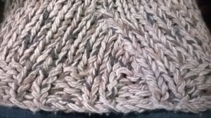 K2tog at the marker creates a "tucked" look