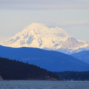 Mount Baker catching the last rays of sunlight after the rest of the hills are in twilight