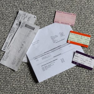 2 airline boarding passes, a train to Birchington, London tube pass, and a Heathrow Express ticket, plus hotel